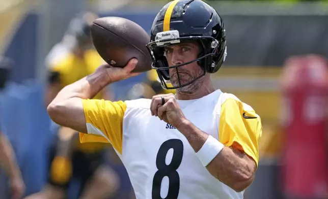 Pittsburgh Steelers quarterback Aaron Rodgers (8) throws. during practice at NFL football minicamp, Tuesday, June 10, 2025, in Pittsburgh. (AP Photo/Gene J. Puskar)