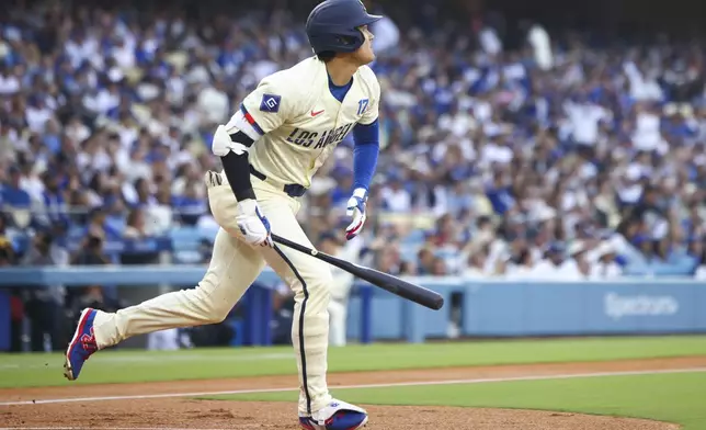 Los Angeles Dodgers designated hitter Shohei Ohtani runs after hitting a home run during the first inning of a baseball game against the San Francisco Giants in Los Angeles, Saturday, June 14, 2025. (AP Photo/Jessie Alcheh)