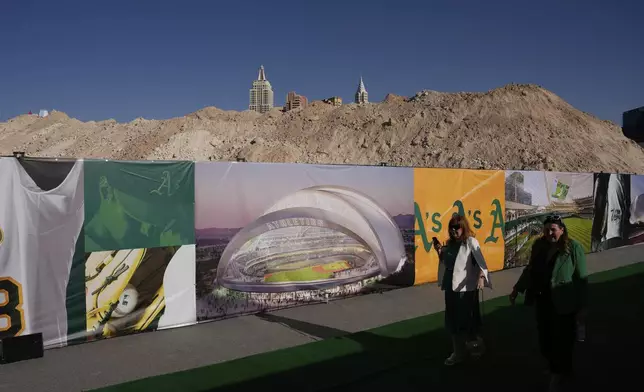 People arrive at a groundbreaking ceremony for the Athletics' baseball stadium Monday, June 23, 2025, in Las Vegas. (AP Photo/John Locher)