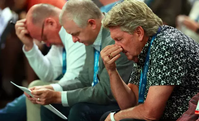 Messengers attending the Southern Baptist Convention bow their heads in prayer during the 2025 SBC Annual Meeting, Tuesday, June 10, 2025, in Dallas. (AP Photo/Richard W. Rodriguez)