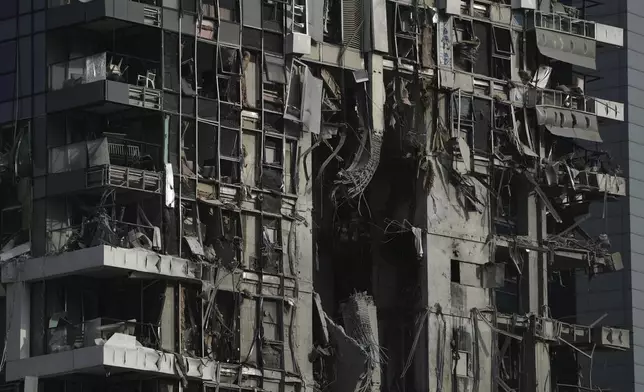 A residential building that was struck by a missile fired from Iran, is seen in Tel Aviv, Israel, on Saturday, June 14, 2025. (AP Photo/Leo Correa)