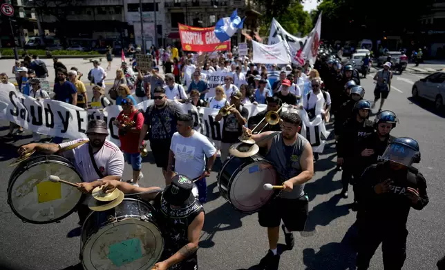 FILE- Public health workers protest against President Javier Milei's austerity measures that affect public health funding, in Buenos Aires, Argentina, Oct. 22, 2024. (AP Photo/Natacha Pisarenko, File)