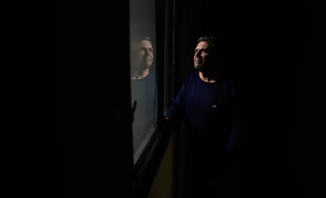 Ariel Wagener, a 47-year-old pizza chef with leukemia who was hospitalized this year with failing kidneys after losing access to his medication, poses for a photo in Buenos Aires, Argentina, Wednesday, April 30, 2025. (AP Photo/Natacha Pisarenko)