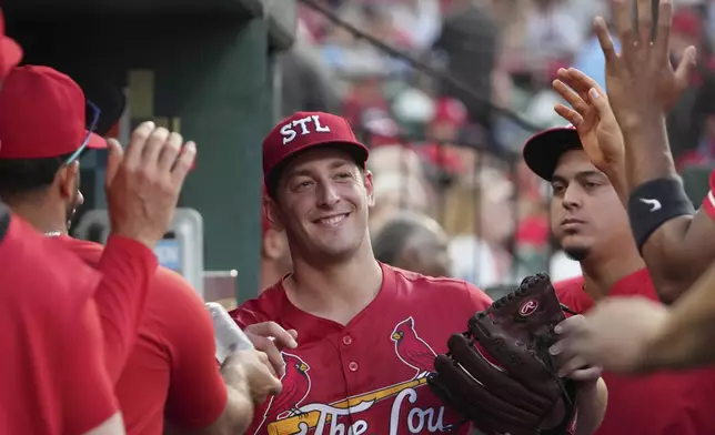 St. Louis Cardinals starting pitcher Andre Pallante smiles in the dugout after being removed during the seventh inning of a baseball game against the Cincinnati Reds Friday, June 20, 2025, in St. Louis. (AP Photo/Jeff Roberson)