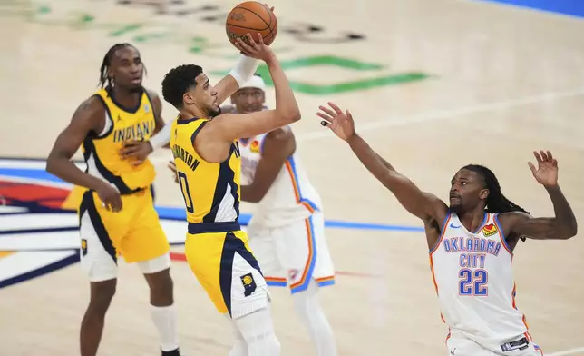 CORRECTS TO GAME WINNING BASKET, NOT 3-PT BASKET - Indiana Pacers guard Tyrese Haliburton (0) shoots the game winning basket over Oklahoma City Thunder guard Cason Wallace (22) in the closing second of the second half of Game 1 of the NBA Finals basketball series Thursday, June 5, 2025, in Oklahoma City. (AP Photo/Julio Cortez)