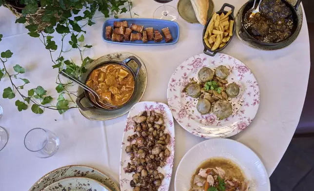Several dishes from the restaurant's menu are photographed at Casa Pedro restaurant in Madrid, Spain, on May 16, 2025. (AP Photo/Manu Fernandez)