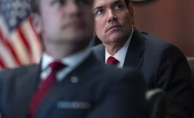 In this image provided by the White House, Defense Secretary Pete Hegseth, in foreground, and Secretary of State Marco Rubio sit in the Situation Room, Saturday, June 21, 2025, at the White House in Washington. (The White House via AP)