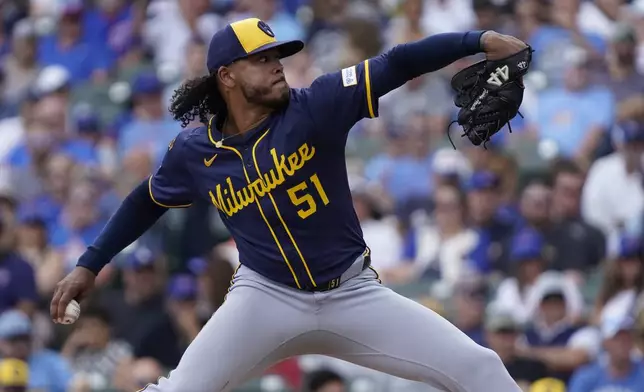 Milwaukee Brewers pitcher Freddy Peralta throws during the first inning of a baseball game against the Chicago Cubs, Thursday, June 19, 2025, in Chicago. (AP Photo/David Banks)