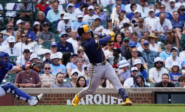 Milwaukee Brewers' Isaac Collins hits a three-run home run against the Chicago Cubs during the fifth inning of a baseball game Thursday, June 19, 2025, in Chicago. (AP Photo/David Banks)