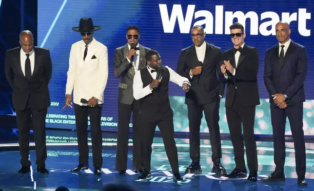 Dondre Whitfield, from left, JB Smoove, Nick Cannon, Kevin Hart, Duane Martin, Robin Thicke, and Boris Kodjoe speak onstage during the BET Awards on Monday, June 9, 2025, at the Peacock Theater in Los Angeles. (AP Photo/Chris Pizzello)