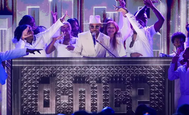 D-Nice, center, speaks during the BET Awards on Monday, June 9, 2025, at the Peacock Theater in Los Angeles. (AP Photo/Chris Pizzello)