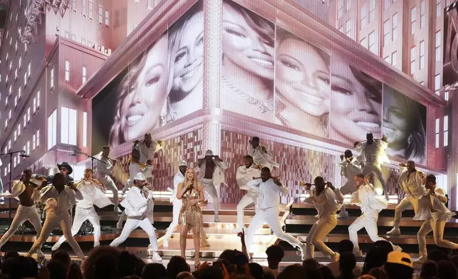 Mariah Carey, center, performs during the BET Awards on Monday, June 9, 2025, at the Peacock Theater in Los Angeles. (AP Photo/Chris Pizzello)
