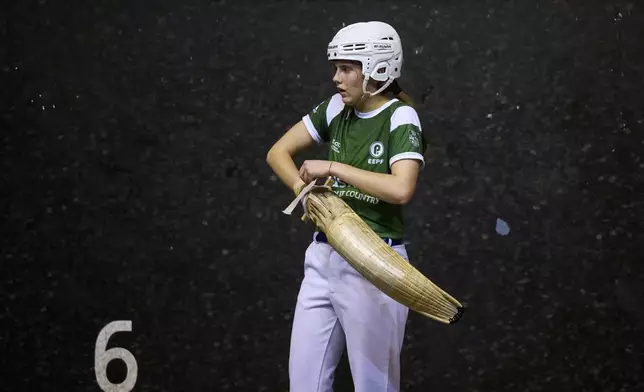 Elaia Gogenola, a member of the Euskadi national team, competes with her teammate Maia Goikoetxea during the Nations League match between the Spanish national team and the Euskadi national team at the Jai Alai fronton in Guernica-Luno, northern Spain, Friday, June 6, 2025. (AP Photo/Miguel Oses)