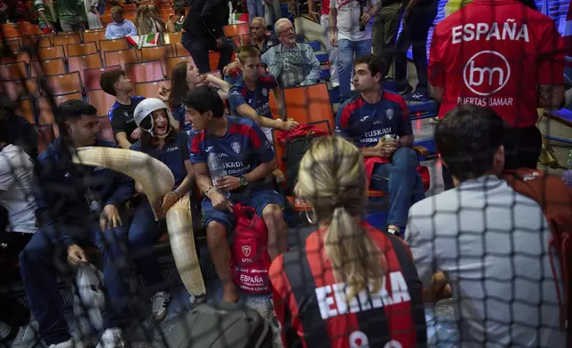 Spectators gather during the Nations League between Spanish national team and Euskadi national team at the Jai Alai fronton in Guernica-Luno, northern Spain, Friday, June 6, 2025. (AP Photo/Miguel Oses)