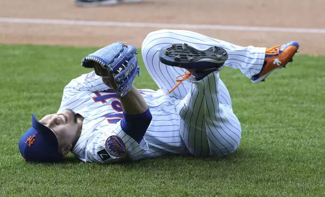 New York Mets pitcher Kodai Senga reacts after an apparent injury during the sixth inning of a baseball game against the Washington Nationals, Thursday, June 12, 2025, in New York. (AP Photo/Pamela Smith)