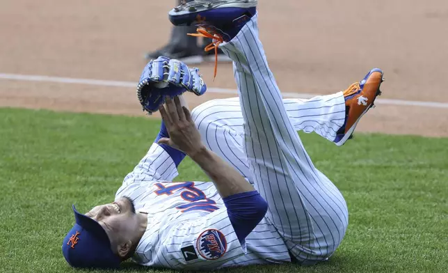 New York Mets pitcher Kodai Senga reacts after an apparent injury during the sixth inning of a baseball game against the Washington Nationals, Thursday, June 12, 2025, in New York. (AP Photo/Pamela Smith)