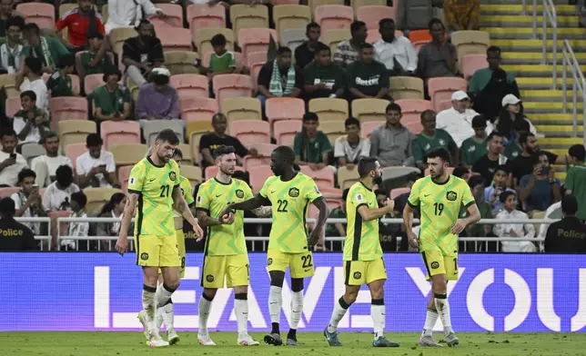 Australia players celebrate after teammate Mitchell Duke scored his side's second goal during a World Cup 2026 Group C qualifying soccer match between Saudi Arabia and Australia at King Abdullah Stadium in Jeddah, Saudi Arabia, Tuesday, June 10, 2025. (AP Photo)