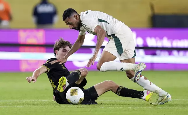 Mexico forward Marcel Ruiz (14) and Saudi Arabia defender Hassan Mahbub (14) collide during a CONCACAF Gold Cup quarterfinal soccer match, Saturday, June 28, 2025, in Glendale, Ariz. (AP Photo/Samantha Chow)