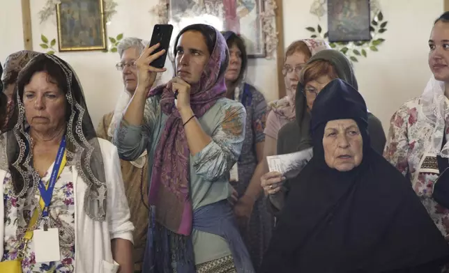 Worshippers fill St. Nicholas Orthodox Church in Kwethluk, Alaska, on June 19, 2025, for the canonization ceremony of Matushka Olga Michael, who became the first female Orthodox saint in North America. (AP Photo/Mark Thiessen)