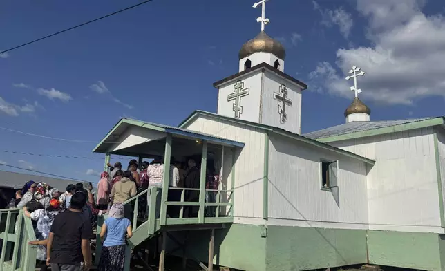 Worshippers wait in long lines to view the remains of St. Olga following her canonization in her hometown of Kwethluk, Alaska, on June 19, 2025. The ceremony drew hundreds of faithful, including from nearby villages and across the world. (AP Photo/Mark Thiessen)