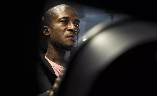 Mohammed Kamal practices handling a tractor-trailer truck in a driving simulator at the Driving Academy on Tuesday, June 10, 2025 in Linden, N.J., where students prepare to obtain a Commercial Driver’s License (CDL) with multilingual instructors. (AP Photo/Angelina Katsanis)