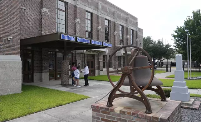Patrons stand outside the Buffalo Soldiers National Museum on Friday, June 27, 2025, in Houston, Texas. (AP Photo/Ashley Landis)