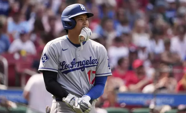 Los Angeles Dodgers' Shohei Ohtani takes his base after being hit by a pitch during the eighth inning of a baseball game against the St. Louis Cardinals Sunday, June 8, 2025, in St. Louis. (AP Photo/Jeff Roberson)
