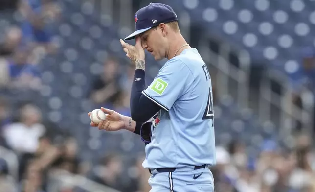 Toronto Blue Jays pitcher Bowden Francis (44) reacts as he stands on the mound during the first inning of a baseball game against the Philadelphia Phillies in Toronto, Tuesday June 3, 2025. (Chris Young/The Canadian Press via AP)