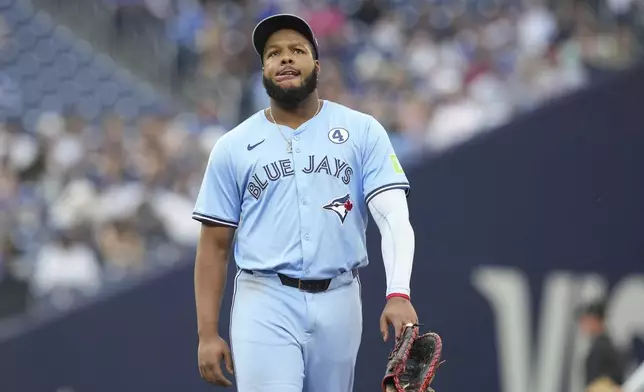 Toronto Blue Jays first baseman Vladimir Guerrero Jr. (27) reacts during the second inning of a baseball game against the Philadelphia Phillies in Toronto, Tuesday June 3, 2025. (Chris Young/The Canadian Press via AP)