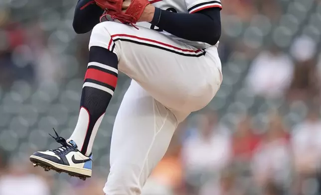 Minnesota Twins starting pitcher Chris Paddack (20) winds up to deliver during the first inning of a baseball game against the Seattle Mariners, Tuesday, June 24, 2025, in Minneapolis. (AP Photo/Abbie Parr)
