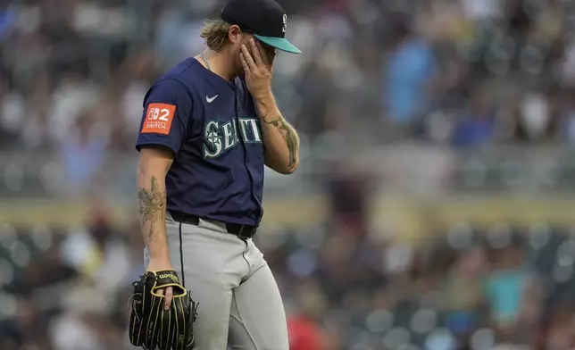 Seattle Mariners relief pitcher Gabe Speier (55) walks back to the dugout during a pitching change in the sixth inning of a baseball game against the Minnesota Twins, Tuesday, June 24, 2025, in Minneapolis. (AP Photo/Abbie Parr)