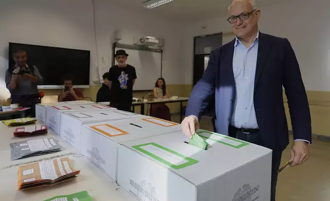 Rome Mayor Roberto Gualtieri casts his ballots on referendums on citizenship and job protections, at a polling station in Rome, Sunday, June 8, 2025. (Cecilia Fabiano/LaPresse via AP)
