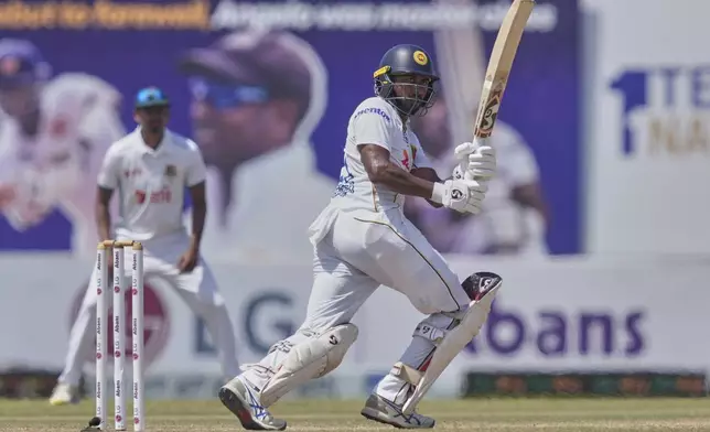 Sri Lanka's Kamindu Mendis plays a shot during day four of the first cricket test match between Sri Lanka and Bangladesh in Galle, Sri Lanka, Friday, June 20, 2025. (AP Photo/Eranga Jayawardena)