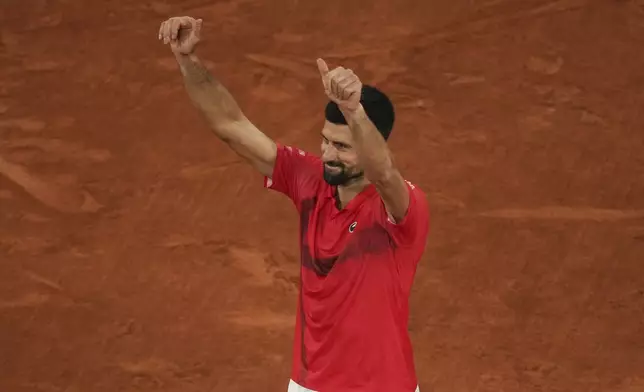 Serbia's Novak Djokovic gestures as he leaves the semifinal match of the French Tennis Open against Italy's Jannik Sinner at the Roland-Garros stadium in Paris, Friday, June 6, 2025. (AP Photo/Christophe Ena)