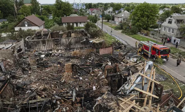 Residential houses are seen destroyed after a Russian drone strike in Pryluky village, Ukraine, Thursday, June 5, 2025. (AP Photo/Evgeniy Maloletka)