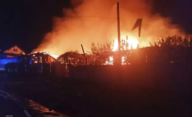 This photo provided by the Ukrainian Emergency Service, shows the fire following Russia's drone attack in the Pryluky, Chernihiv region, Ukraine, Thursday, June 5, 2025. (Ukrainian Emergency Service via AP)