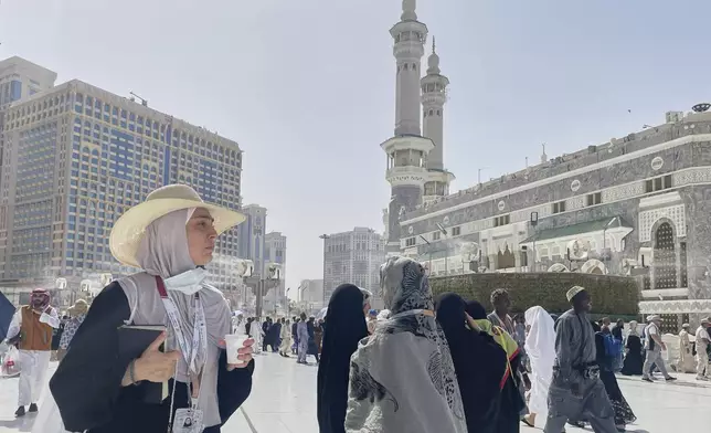 A Muslim pilgrim enters the Grand Mosque, during the annual Hajj pilgrimage in Mecca, Saudi Arabia, Monday, June 2, 2025. (AP Photo/Amr Nabil)
