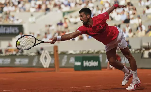 Serbia's Novak Djokovic plays a shot against Britain's Cameron Norrie during their fourth round match of the French Tennis Open at the Roland-Garros stadium in Paris, Monday, June 2, 2025. (AP Photo/Aurelien Morissard)