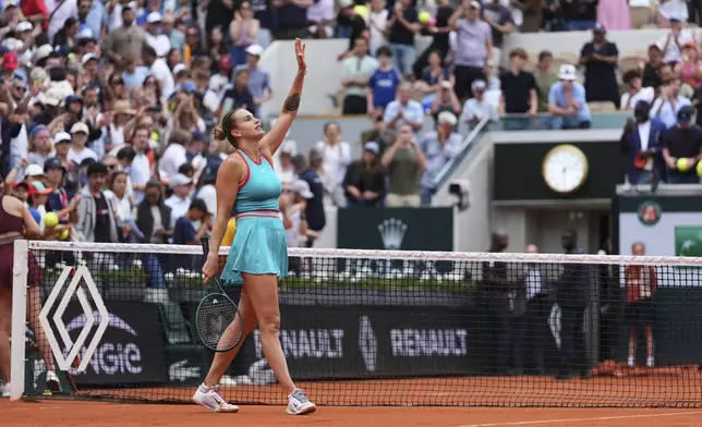 Aryna Sabalenka of Belarus celebrates beating Amanda Anisimova of the U.S. during their fourth round match of the French Tennis Open, at the Roland-Garros stadium, in Paris, Sunday, June 1 2025. (AP Photo/Lindsey Wasson)