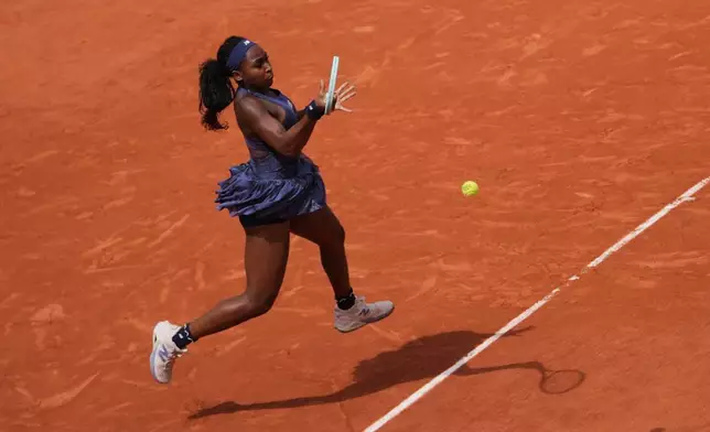 Coco Gauff of the U.S. plays a shot against Russia's Ekaterina Alexandrova during their fourth round match of the French Tennis Open at the Roland-Garros stadium in Paris, Monday, June 2, 2025. (AP Photo/Thibault Camus)