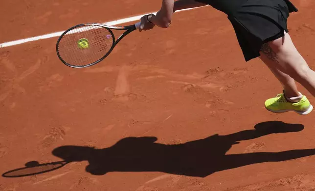 Ukraine's Elina Svitolina casts her shadow on the court as she returns the ball to Italy's Jasmine Paolini during their fourth round match of the French Tennis Open, at the Roland-Garros stadium, in Paris, Sunday, June 1 2025. (AP Photo/Christophe Ena)