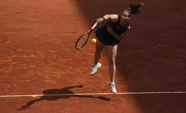 Australia's Daria Kasatkina plays a shot against Russia's Mirra Andreeva during their fourth round match of the French Tennis Open at the Roland-Garros stadium in Paris, Monday, June 2, 2025. (AP Photo/Christophe Ena)