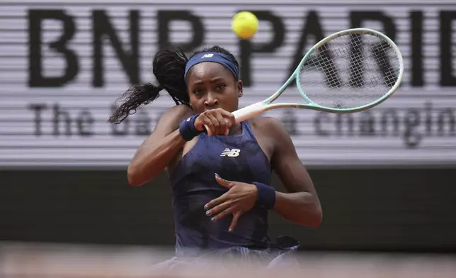 Coco Gauff of the U.S. plays a shot against Russia's Ekaterina Alexandrova during their fourth round match of the French Tennis Open at the Roland-Garros stadium in Paris, Monday, June 2, 2025. (AP Photo/Thibault Camus)