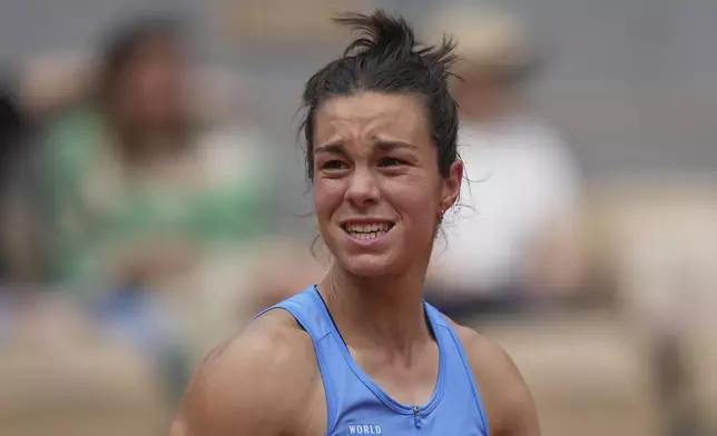 France's Lois Boisson reacts as she plays against Jessica Pegula of the U.S. during their fourth round match of the French Tennis Open at the Roland-Garros stadium in Paris, Monday, June 2, 2025. (AP Photo/Thibault Camus)