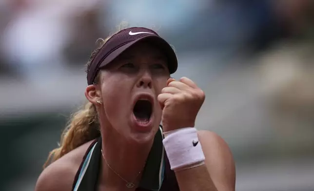 Russia's Mirra Andreeva reacts as she plays against Australia's Daria Kasatkina during their fourth round match of the French Tennis Open at the Roland-Garros stadium in Paris, Monday, June 2, 2025. (AP Photo/Christophe Ena)