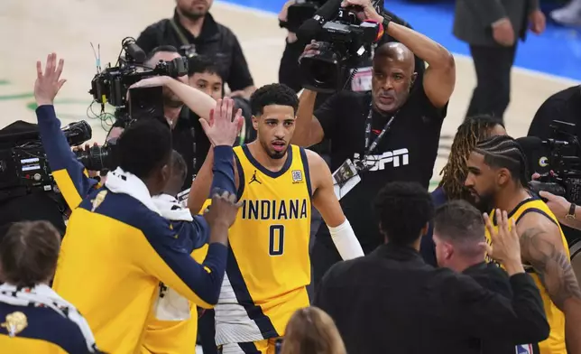 Indiana Pacers guard Tyrese Haliburton (0) leaves the court after winning Game 1 of the NBA Finals basketball series against the Oklahoma City Thunder Thursday, June 5, 2025, in Oklahoma City. (AP Photo/Julio Cortez)