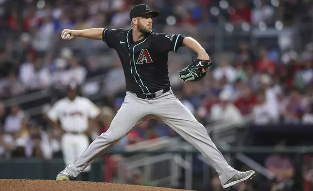 Arizona Diamondbacks pitcher Merrill Kelly delivers in the second inning of a baseball game against the Atlanta Braves, Wednesday, June 4, 2025, in Atlanta. (AP Photo/Colin Hubbard)