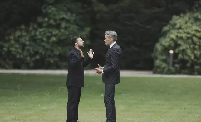 Netherland's Prime Minister Dick Schoof, right, speaks with Ukraine's President Volodymyr Zelenskyy during a meeting at the Catshuis on the sidelines of the NATO summit in The Hague, Netherlands, Tuesday, June 24, 2025. (AP Photo/Markus Schreiber)
