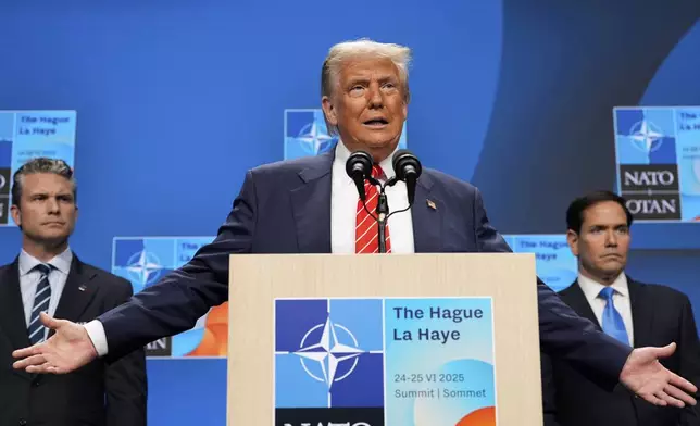 President Donald Trump speaks during a media conference at the end of the NATO summit as Foreign Secretary Marco Rubio, right, and Defence Secretary Pete Hegseth listen, in The Hague, Netherlands, Wednesday, June 25, 2025. (AP Photo/Alex Brandon)
