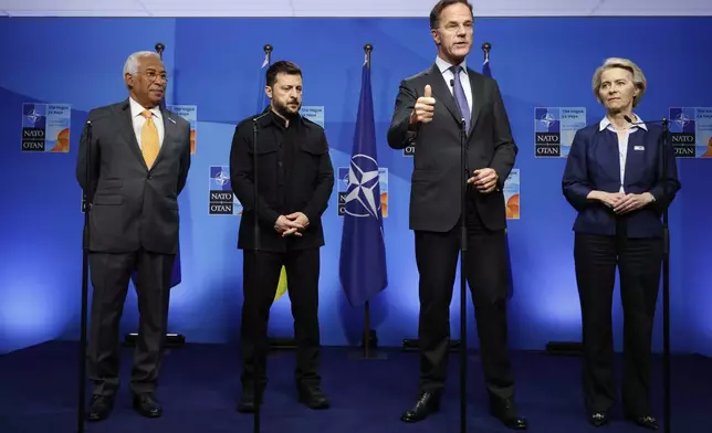 From left, European Council President Antonio Costa, Ukraine's President Volodymyr Zelenskyy, NATO Secretary General Mark Rutte and European Commission President Ursula von der Leyen speak prior to a meeting on the sidelines of the NATO summit in The Hague, Netherlands, Tuesday, June 24, 2025. (AP Photo/Geert Vanden Wijngaert)